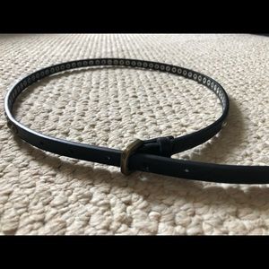 Thin black belt with metal hardware